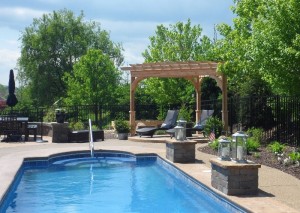 pergola and outdoor furniture by a pool