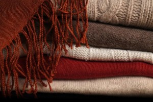 pile-woolen-sweaters-scarf-several-stacked-top-each-other-top-them-45099335