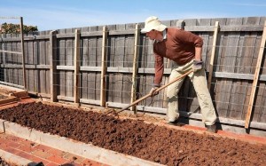 how-to-prepare-a-garden-bed-for-planting-preparation-of-soil-for-planting-man-soil-in-raised-garden-bed-preparing-garden-bed-for-spring-planting