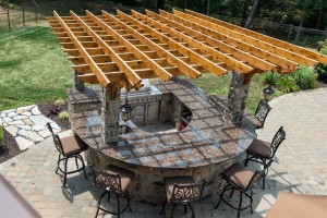 Fifthroom.com's Pergola hangs overtop an outdoor kitchen.